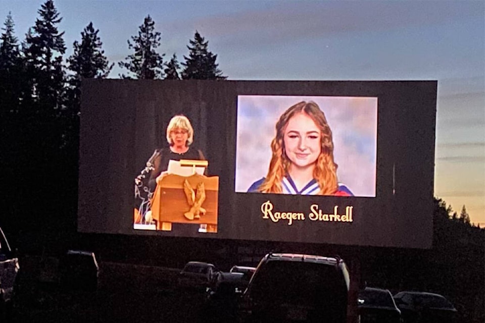 Pam Gretzinger, a teacher at Eagle River Secondary, speaks as graduate Raegen Starkell’s photo is on the drive-in screen on June 17, 2021 in Enderby. (Contributed)