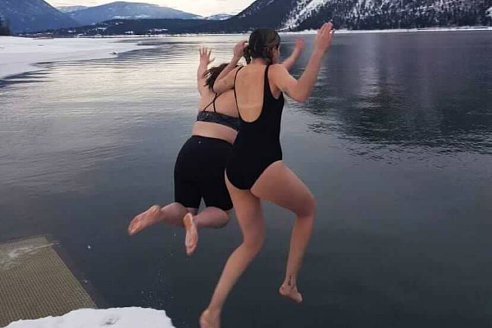 Naomi Seal and Richelle Zarowski take the Polar Plunge on New Year’s Day, Jan. 1, in Canoe. (Photo contributed)