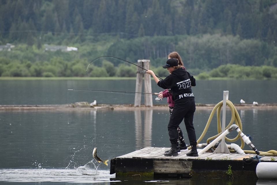 Student Abigael Fletcher lands a fish on June 10, 2022 at the docks at Marine Peace Park as part of a fishing program for Shuswap Middle School students put on each year by Indigenous education workers Theresa Johnson and Kaeli Hawrys as part of Indigenous History Month. (Martha Wickett-Salmon Arm Observer)