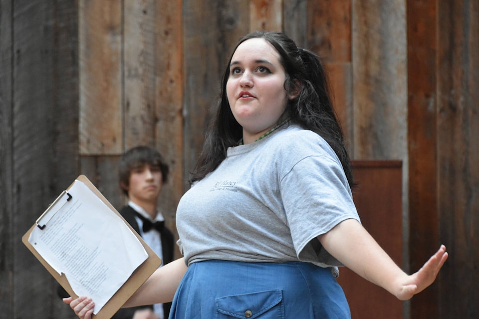 Natalie Kearl, playing stage manager and Jessie Herald in Villains and Vittles Dinner Theatre Productions’ That’s Not Shakespeare, helps keep the audience laughing on Aug. 10, 2022 at R.J. Haney Heritage Village’s SASCU Amphitheatre. (Martha Wickett-Salmon Arm Observer)