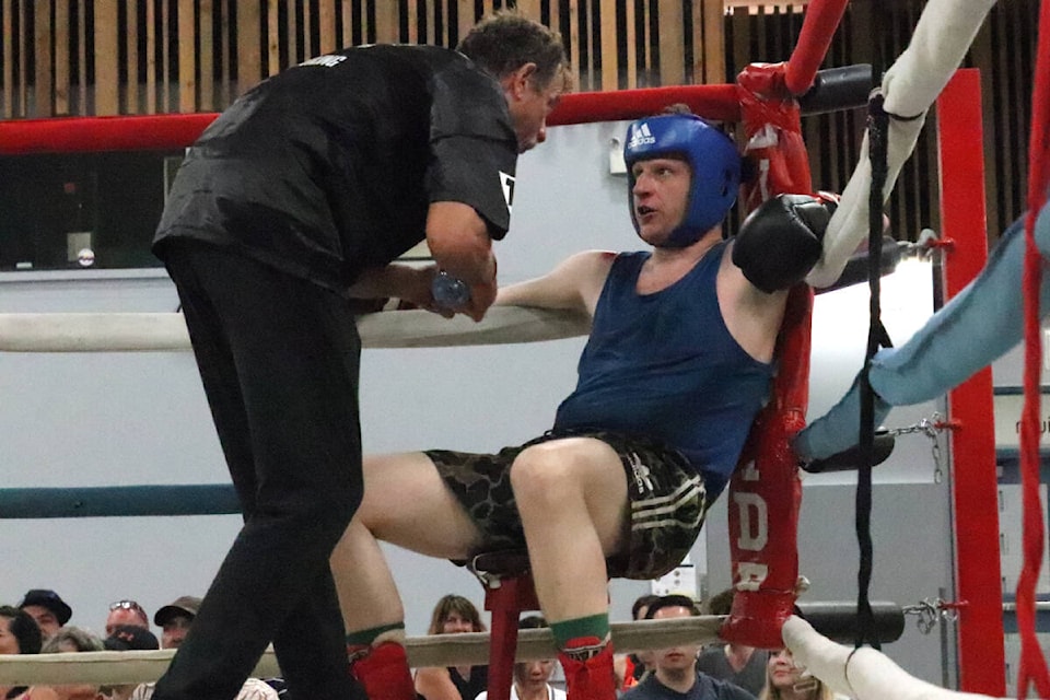 Kelowna Los Gatos Locos Boxing Club fighter Landon Onkel takes a breather between rounds while listening to trainer Geoff Lawrence during the Ian Gibson Tribute Boxing Show Saturday, Aug. 20, at the Vernon Recreation Centre. (Roger Knox - Morning Star)