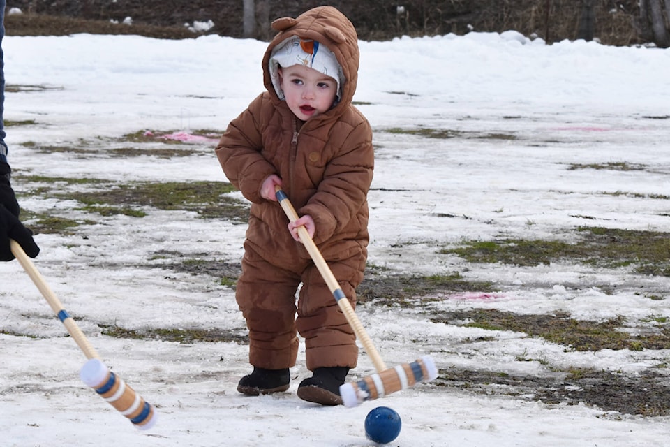 Ballack Campbell plays croquet in the snow at Salmon Arm’s Winter Fun Fest, Feb. 18, 22023. (Rebecca Willson- Salmon Arm Observer)