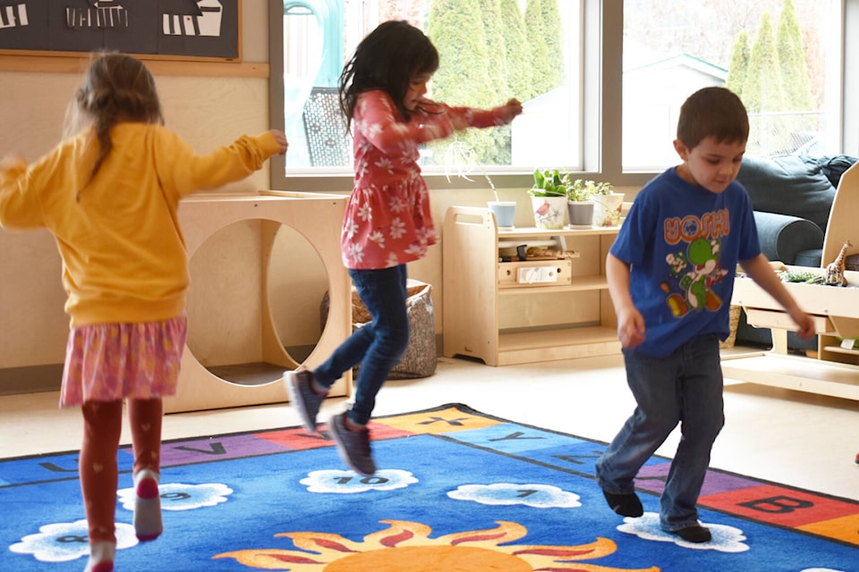 Vaida Carlson, Natalie Wilson and Jackson Shepherd play a hopscotch game at Kids Kingdom Childcare Society’s open house on Saturday April 1, 2023. (Rebecca Willson/ Eagle Valley News)