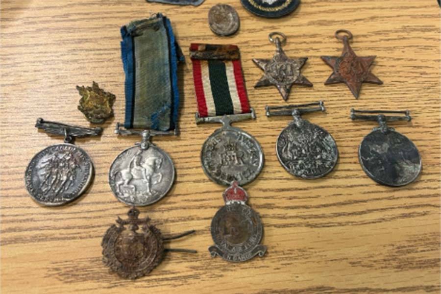 32826381_web1_230524-ABB-LostMedalsFoundRiver-medals_1
