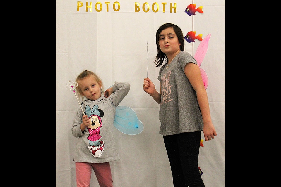 Emmerson Lyle (left), age four, and Madison Lozo (right), age nine, pose as fairies at the Lakeview Parent Link Centre photo booth on Oct. 18. Photo by Kaylyn Whibbs/Eckville Echo