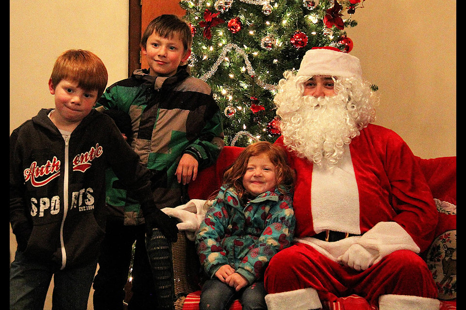 Jayda, Ryker and Jed were visiting grandma, but made sure they had time to let Santa know what is on their Christmas lists. Photo by Kaylyn Whibbs/Eckville Echo