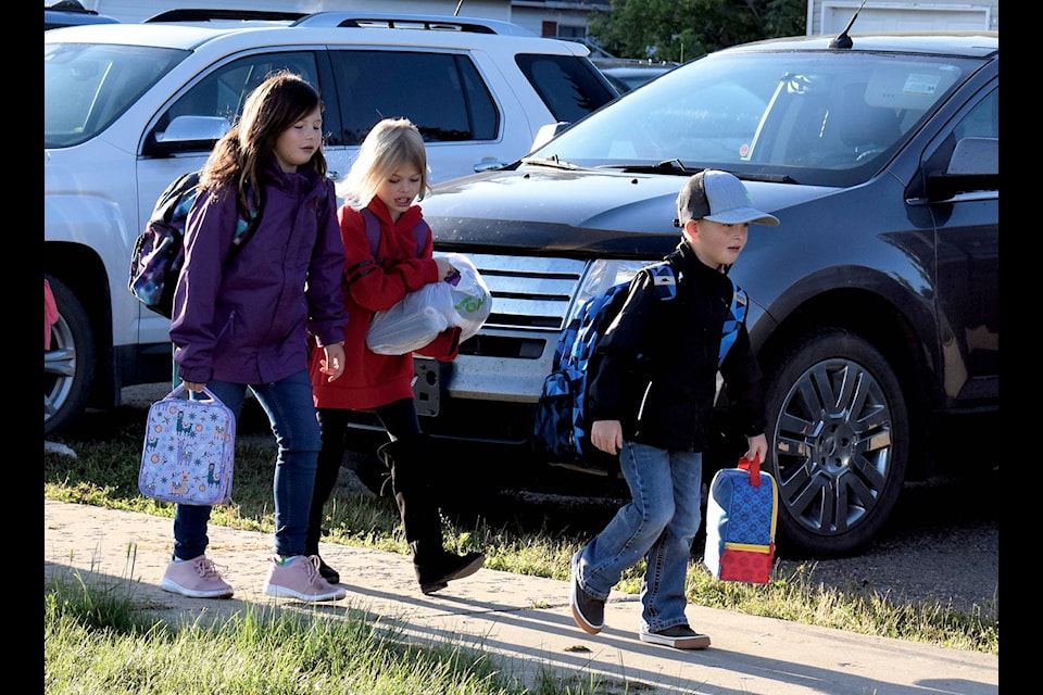 Students make their way to the doors of Eckville Elementary School on Sept. 3 for the first day of a new school year.