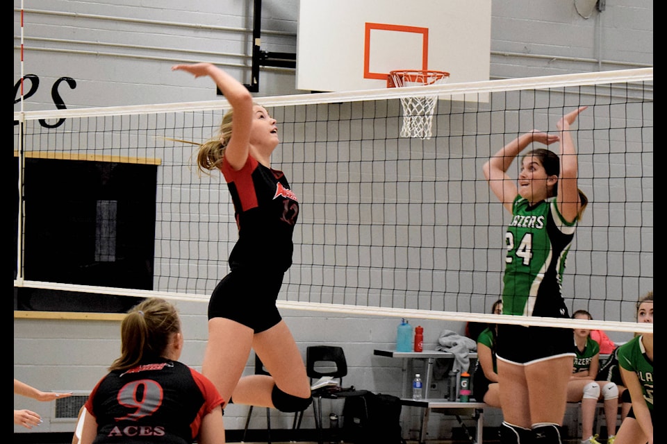 Madison Smith leaps to hit the ball back into Blazer’s territory during the Wednesday night matchup on Oct. 16. The senior girls Eckville Aces came out with a 3-1 win over Bowden. Photo by Kaylyn Whibbs/Eckville Echo