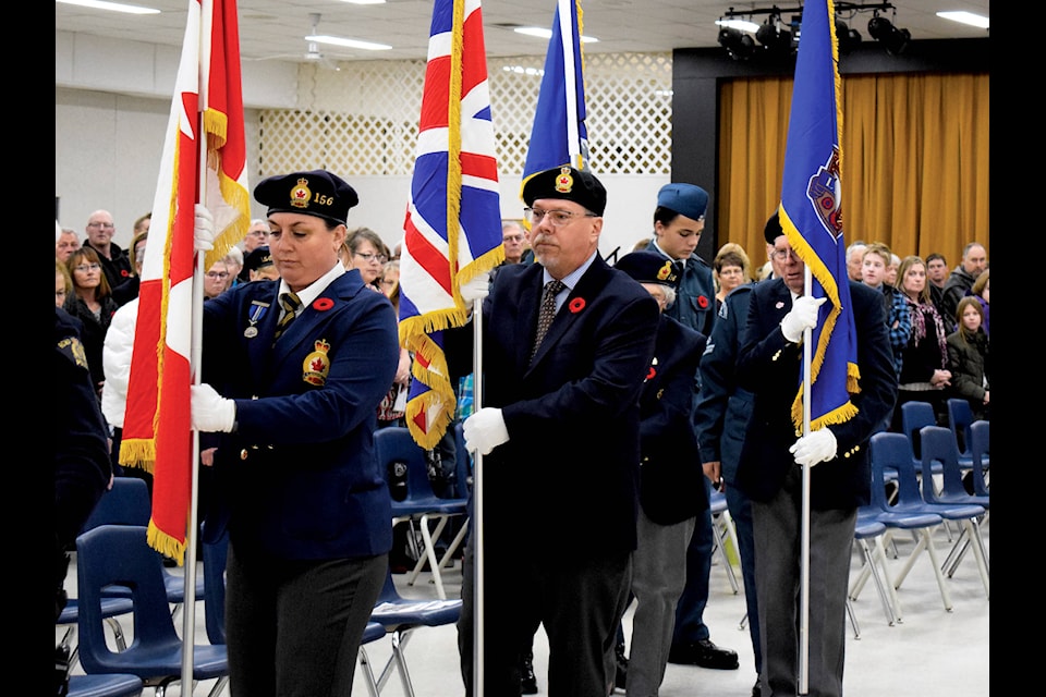 The Procession of the Legion and Colour Party, lead by a member of the RCMP, marched in to the Eckville Community Centre in the beginning legs of the Remembrance Day service on Nov. 11. Photo by Kaylyn Whibbs/Eckville Echo