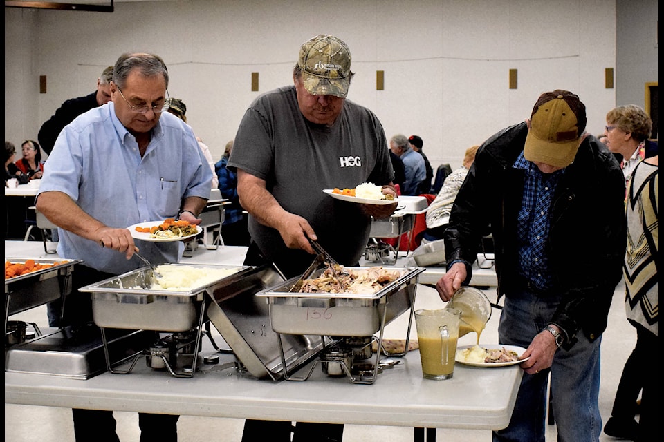 Turkey Supper attendees make their way though the buffet set up in the Eckville Community Centre on Nov. 8. The annual event hosted by St. Paul’s Presbyterian Church invites community members to come out and enjoy a full turkey supper. Photo by Kaylyn Whibbs/Eckville Echo