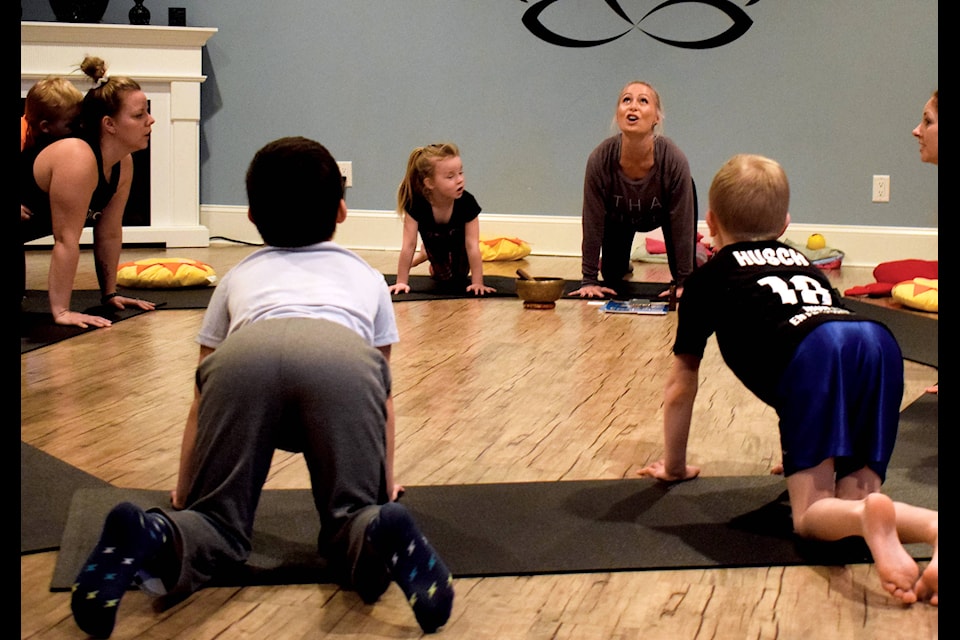 Yogis gathered at Peace In A Pod Yoga Studio on Feb. 7 for a session of family yoga. Photo by Kaylyn Whibbs/Eckville Echo
