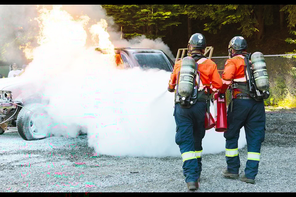 Mine rescue workers extinguish a fire (Elk Valley Resources Photo)
