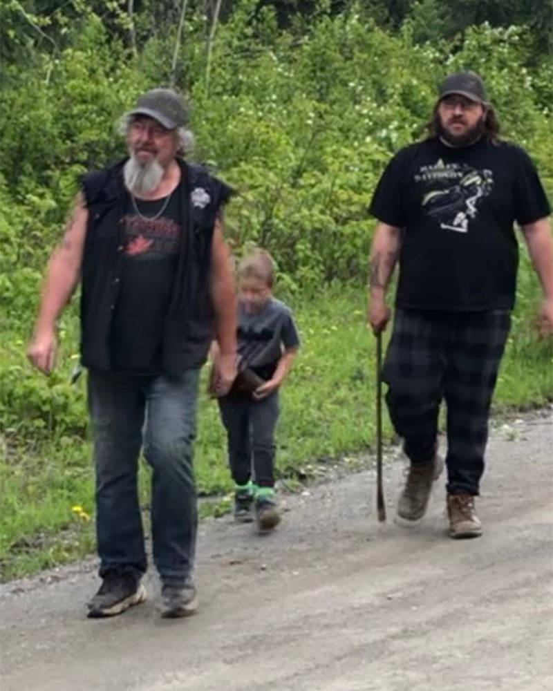Wyatt Bednarz, left, his grandson Stryker and son Brad go in search of tools they used to ward a bear off attacking a baby calf. (Gail Bednarz photo)