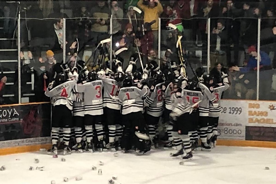 The Ghostriders celebrate a 4-3 victory over the Columbia Valley Rockies in the third game of their playoff series on Feb. 25, 2022, at the Fernie Memorial Arena. (Joshua Fischlin/The Free Press)