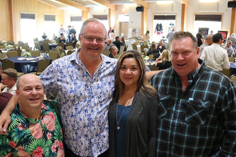 From left to right: Abbey White, Ian Benson, Monique Lee, and Len Gostick. The first three are organizers of the bi-annual Bearspaw Contracting ‘Community First’ Society golf tournament and gala event, and Gostick was an original co-founder and continual sponsor of the event. (Joshua Fischlin/The Free Press)