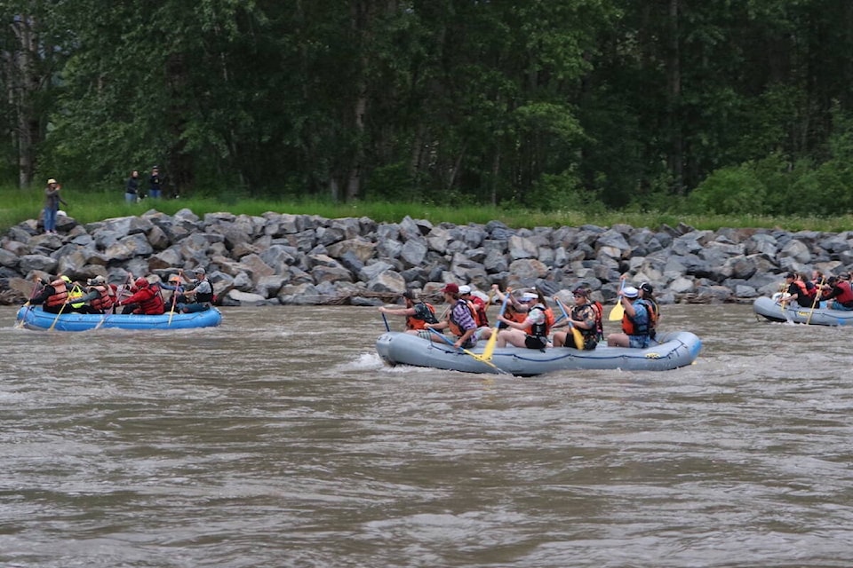 Rafters in the 26th Canyon Raft Company race on June 22, 2022, heading for the finish line at the West Fernie Bridge. (Joshua Fischlin/The Free Press)