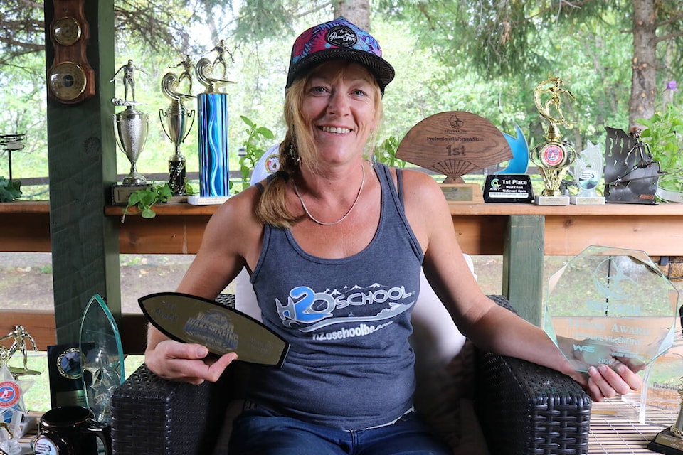Caroline Villeneuve surrounded by the many trophies earned during her competitive wakesurfing career. (Joshua Fischlin/The Free Press)
