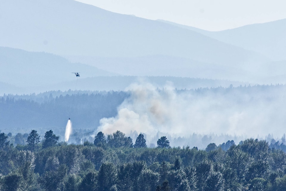33384987_web1_230723-CDT-SundaySMRFireUpdate-HelicopterWater_1