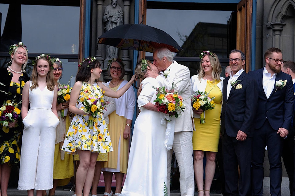 Green Party Leader Elizabeth May shares a kiss with her new husband, John Kidder, at the top of the stairs of the Christ Church Cathedral in Victoria, B.C. on April 22, 2019. (Nicole Crescenzi/News Staff)