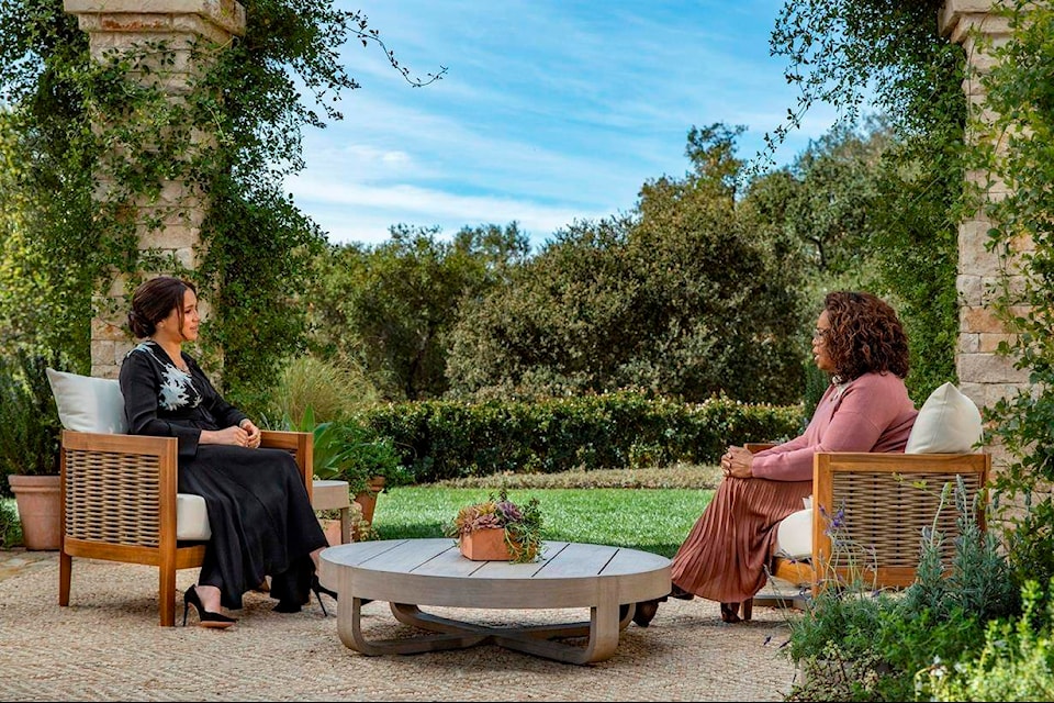 This image provided by Harpo Productions shows Meghan, The Duchess of Sussex, left, in conversation with Oprah Winfrey. (Joe Pugliese/Harpo Productions via AP)