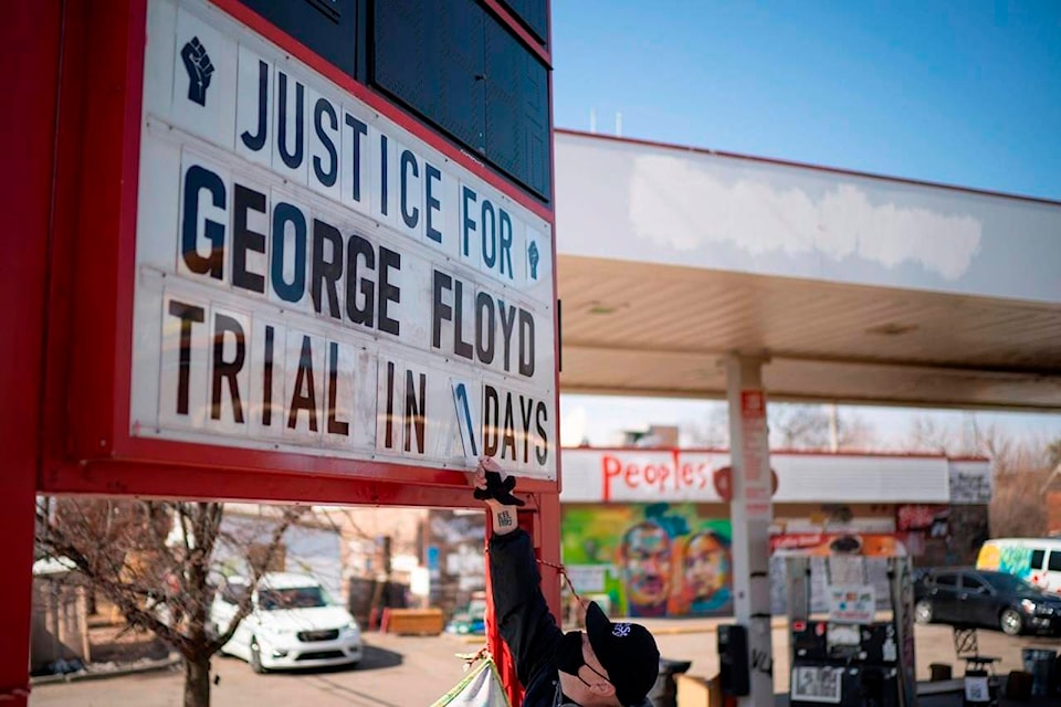 Billy Briggs, who lives just 170 steps from where George Floyd was killed, created and maintains the countdown sign at the gas station on the corner of George Floyd Square in Minneapolis, Minn. On Sunday, the eve of the trial date, he updated it to “1”. (Jeff Wheeler /Star Tribune via AP)