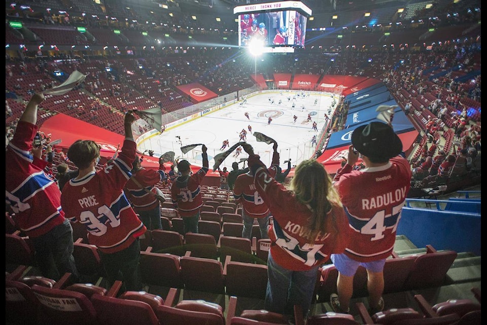 Fans watch the warm-up before Game 6 between the Toronto Maple Leafs and the Montreal Canadiens in NHL playoff hockey action Saturday, May 29, 2021 in Montreal. Quebec’s easing of COVID-19 restrictions will allow 2,500 fans to attend the game for the first time in fourteen months. THE CANADIAN PRESS/Ryan Remiorz