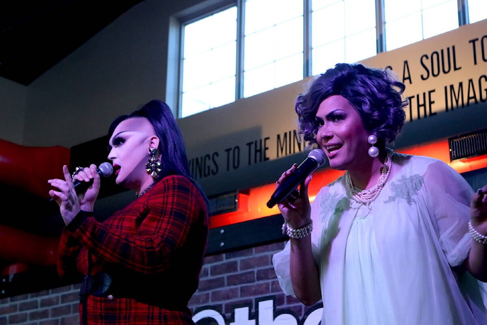 Kelowna drag queens and Okanagan Drag Collective members Jenna Telz (left) and Ella Lamoureux at the goup’s inaugural show at Kelowna’s DunnEnzies Pizza Mission location on Nov. 20. (Aaron Hemens/Capital News)