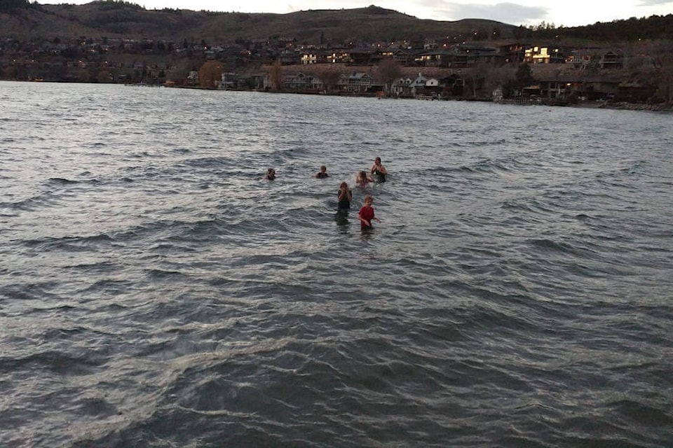 Two moms and eight kids aged five to 15 took advantage of the record-setting temperature Wednesday, Dec. 1, to take a dip in Kal Lake. (Contributed)