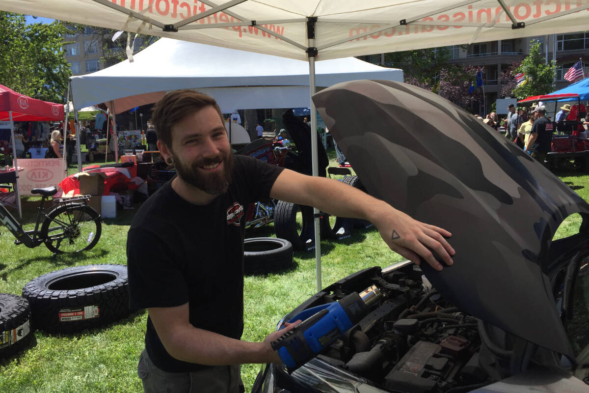 Harrison from Bling Performance in Penticton added vinyl wrap to vehicles throughout the day on Saturday, June 25, at the Peach City Beach Cruise. The local business was among those with tents set up in Gyro Park, offering different services to community members all day long.