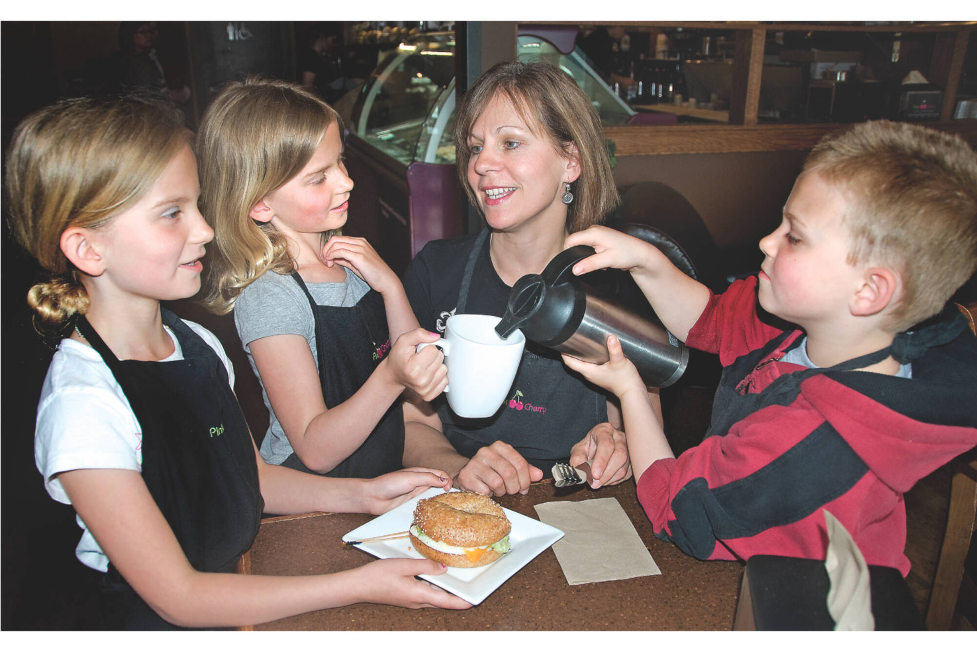 Helen Charlton receives coffee and a meal at the Pink Cherry from her children Natasha, Charlotte and William in this photo from the May 5, 2010 Salmon Arm Observer.