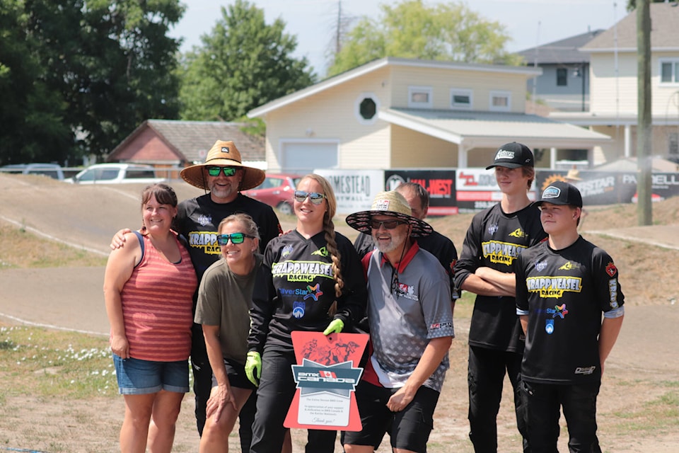 Vernon BMX Club president and track operator Shylo Orchard (fourth from left) poses for a picture with other BMX Club members. (Brendan Shykora - Morning Star)