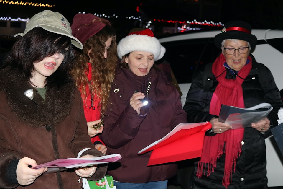 Carollers from Jubilee Christian Community Church toured a Langford neighbourhood on Dec. 6 to sing Christmas carols and collect donations for the Goldstream Food Bank.