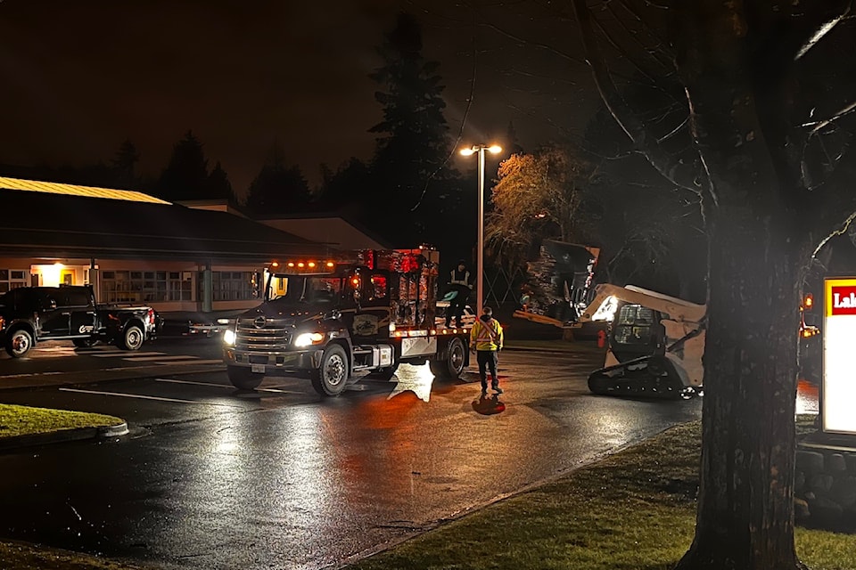 West Shore RCMP officers could be seen taking pallets "full of boxes" from a property in Langford, which were loaded onto a flatbed truck waiting nearby.