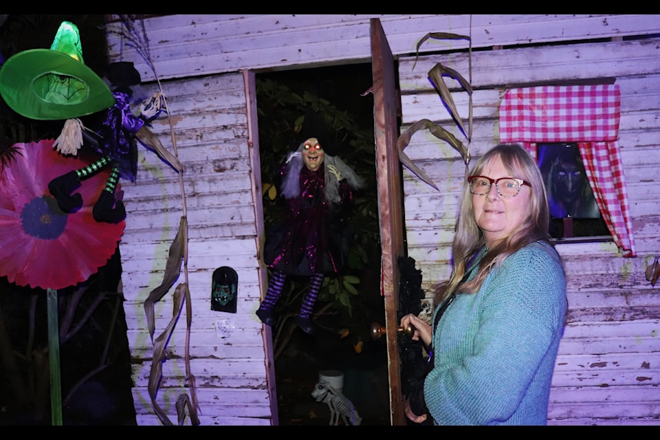 Debbie Briggs seems to have some guests in the shed at her Linden Avenue Halloween display.