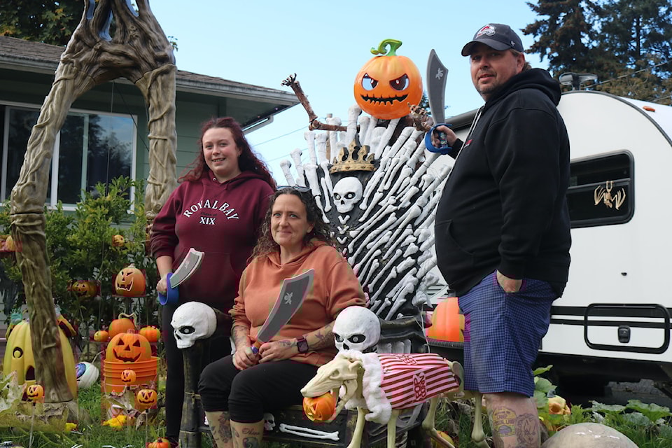 The Bowers – daughter Jasmine, mother Melissa and father Len – are raising money for Goldstream Food Bank with their pirate-themed Halloween display.