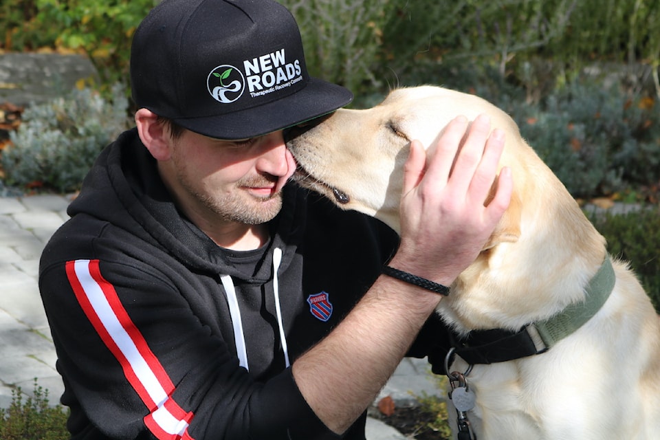 New Roads Therapeutic Recovery Community resident, Dan, with therapy dog Jango.