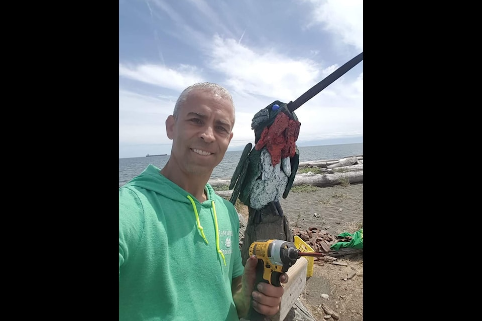 Paul Lewis with one of the sculptures discovered missing at Esquimalt Lagoon on Oct. 17. 