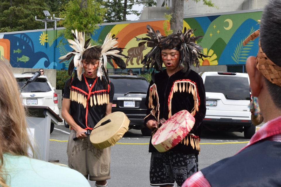 Singers perform at the mural's unveiling.