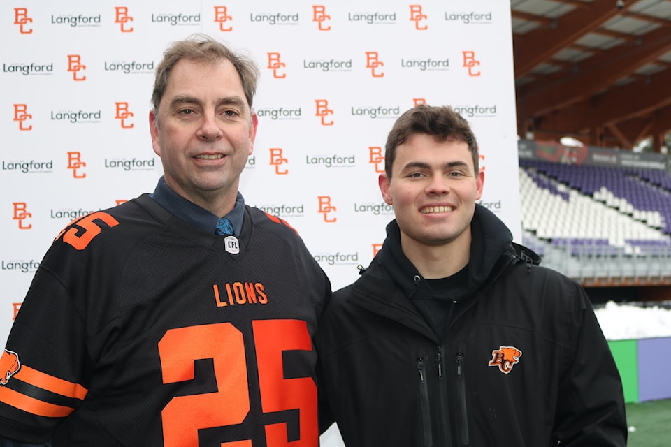 Langford Mayor Scott Goodmanson with B.C. Lions quarterback and Victoria-born Nathan Rourke.