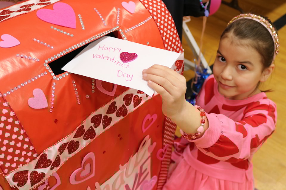 Kids and parents at Ruth King Elementary School's Valentine's fundraiser crafted cards for Langford seniors.