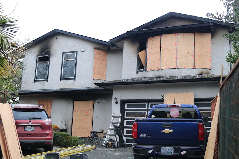 The Damon Drive home in View Royal is boarded up following the arson attack on Jan. 7.