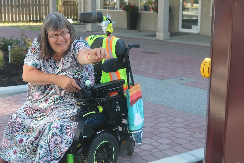 Krista Wright struggles to reach a pedestrian crossing button at Peatt Road, Hockley Avenue roundabout.