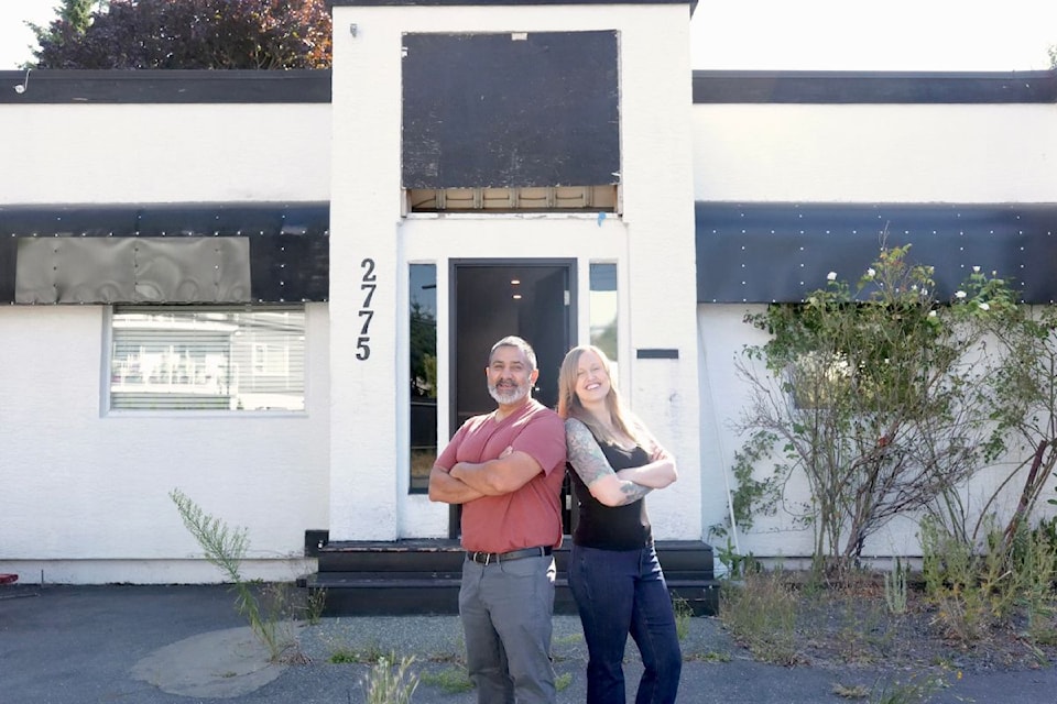 Jenny Nadeau and Mike Manhas stand outside the former biker clubhouse on Spencer Road, soon to be transformed into The Forge – a first-of-its-kind recovery and mental-health hub for tradespeople across B.C.