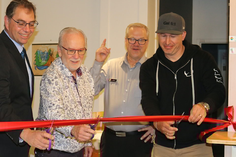 Langford Mayor Scott Goodmanson, Bill Beadle, Pat Hunble and Ben Gulbrandsen from Viking Properties cut the ribbon, officially opening the Dignity Project.