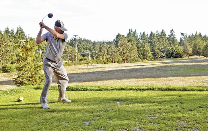 Dave Hutchinson, member of the Metchosin Golf Course, Lines up a drive.18:50