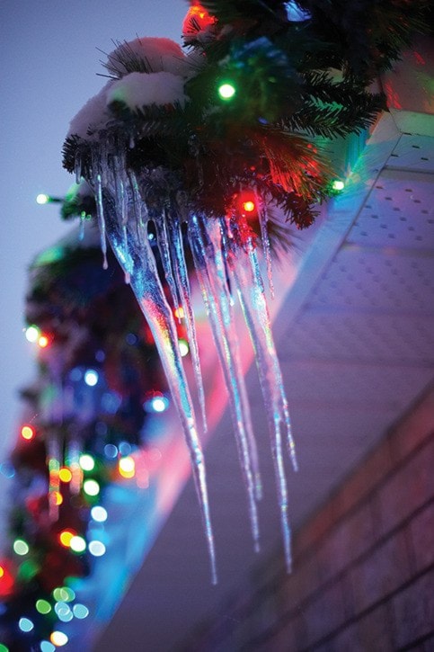 Icicles and Christmas lights on house in Gatineau, Quebec, Canada