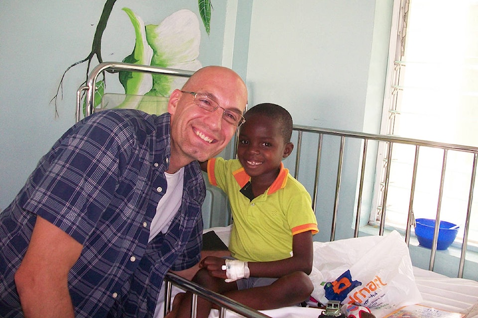 Money raised by the Westshore Sunrise Rotary Club helped pay the medical bills for nine-year-old Francy (right). He lives at the Divine Hand Orphanage in Haiti, one of two supported by the local club. Photo courtesy of Doris Abraham