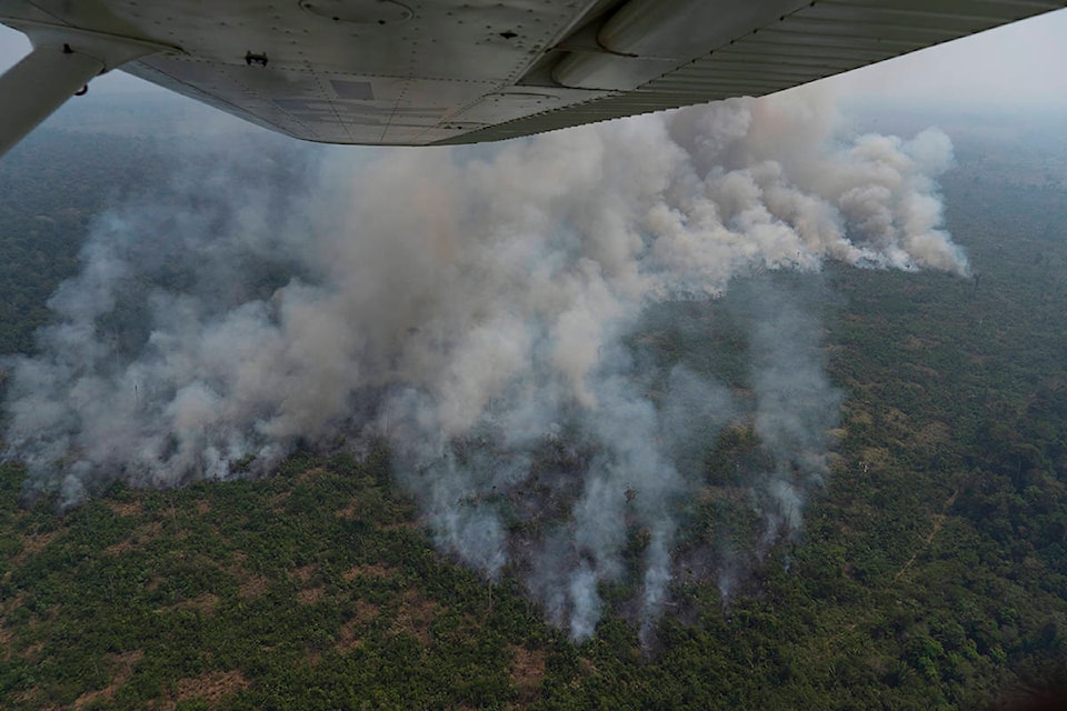 Fire consumes an area near Porto Velho, Brazil, Friday, Aug. 23, 2019. Brazilian state experts have reported a record of nearly 77,000 wildfires across the country so far this year, up 85% over the same period in 2018. Brazil contains about 60% of the Amazon rainforest, whose degradation could have severe consequences for global climate and rainfall. (AP Photo/Victor R. Caivano)