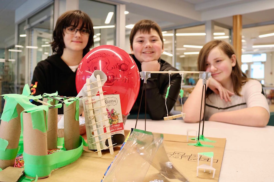 Grade 6 Dunsmuir Middle students (right) Gabriella Friesen, Jovanna Lozupone and Keira Mansell’s ultimate playground features a makeshift hot air balloon. (Aaron Guillen/News Staff)