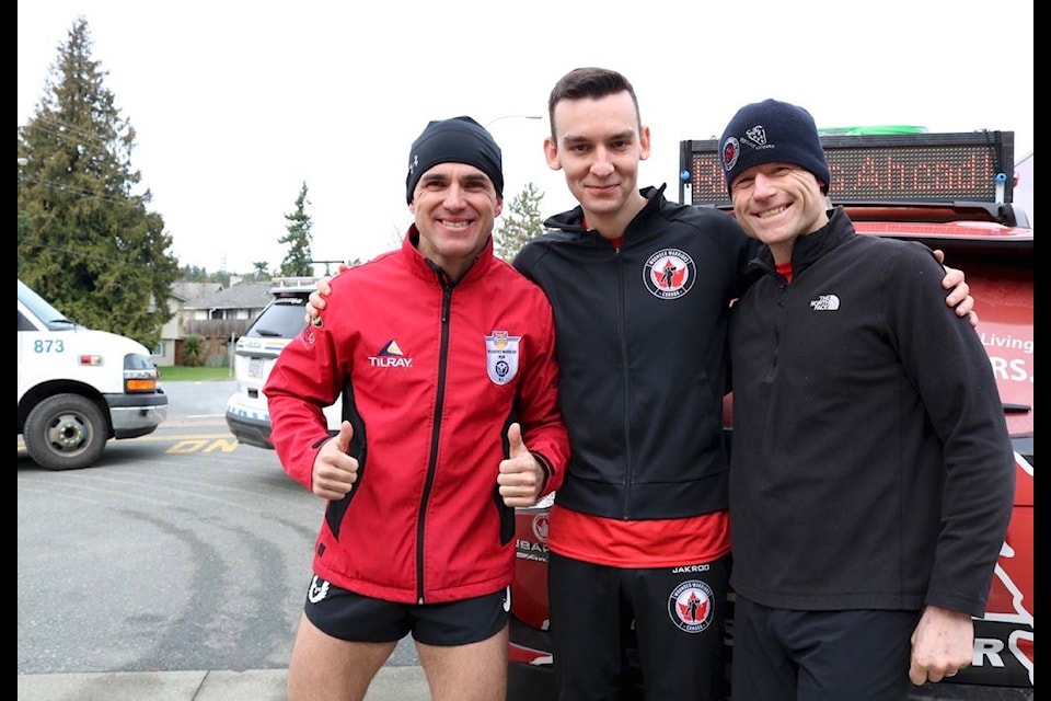 Steve Deschamps (left), Mark Blachuras and Allan Kobayashi stopped by Langford Fire Hall for a quick pitstop before continuing on their 65km run from Sooke to Sidney. Their run is the final fundraising effort before the Wounded Warriors Canada Relay Run covers 600km from Port Hardy to Victoria in late February. (Aaron Guillen/News Staff)